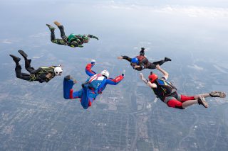 Licensed skydivers flying belly to earth having a great time while trying to build a formation