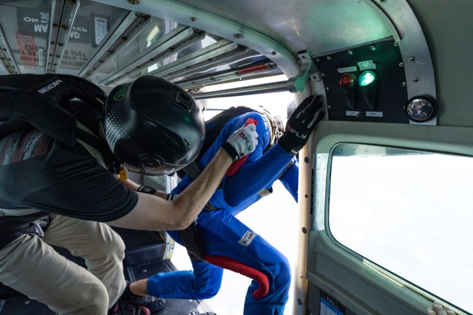 View from inside the plane as two licensed skydivers exit.