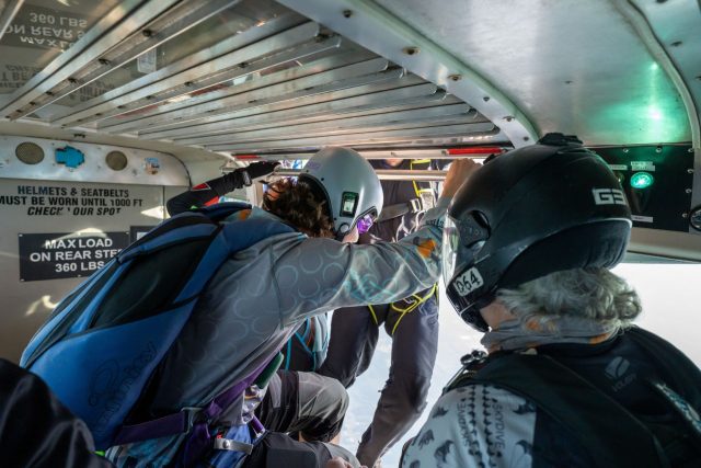 skydivers prepare to exit the airplane