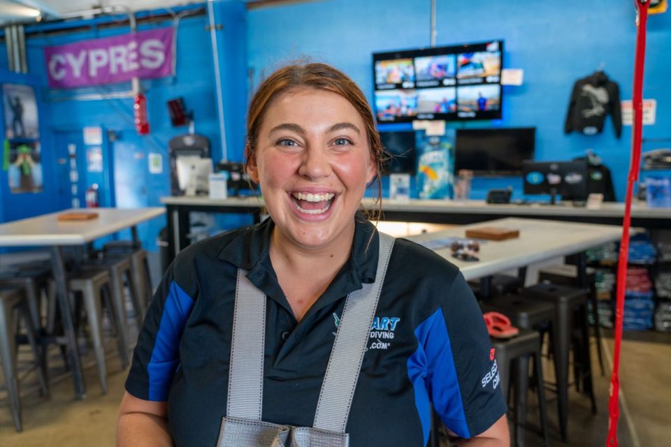 Cheery looking Start Skydiving employee Abby Bishop captured mid laugh