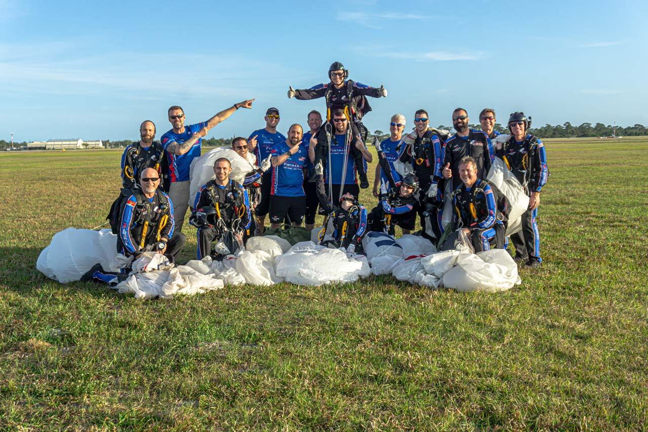 Start Skydiving Team Fastrax skydivers posing after a jump together