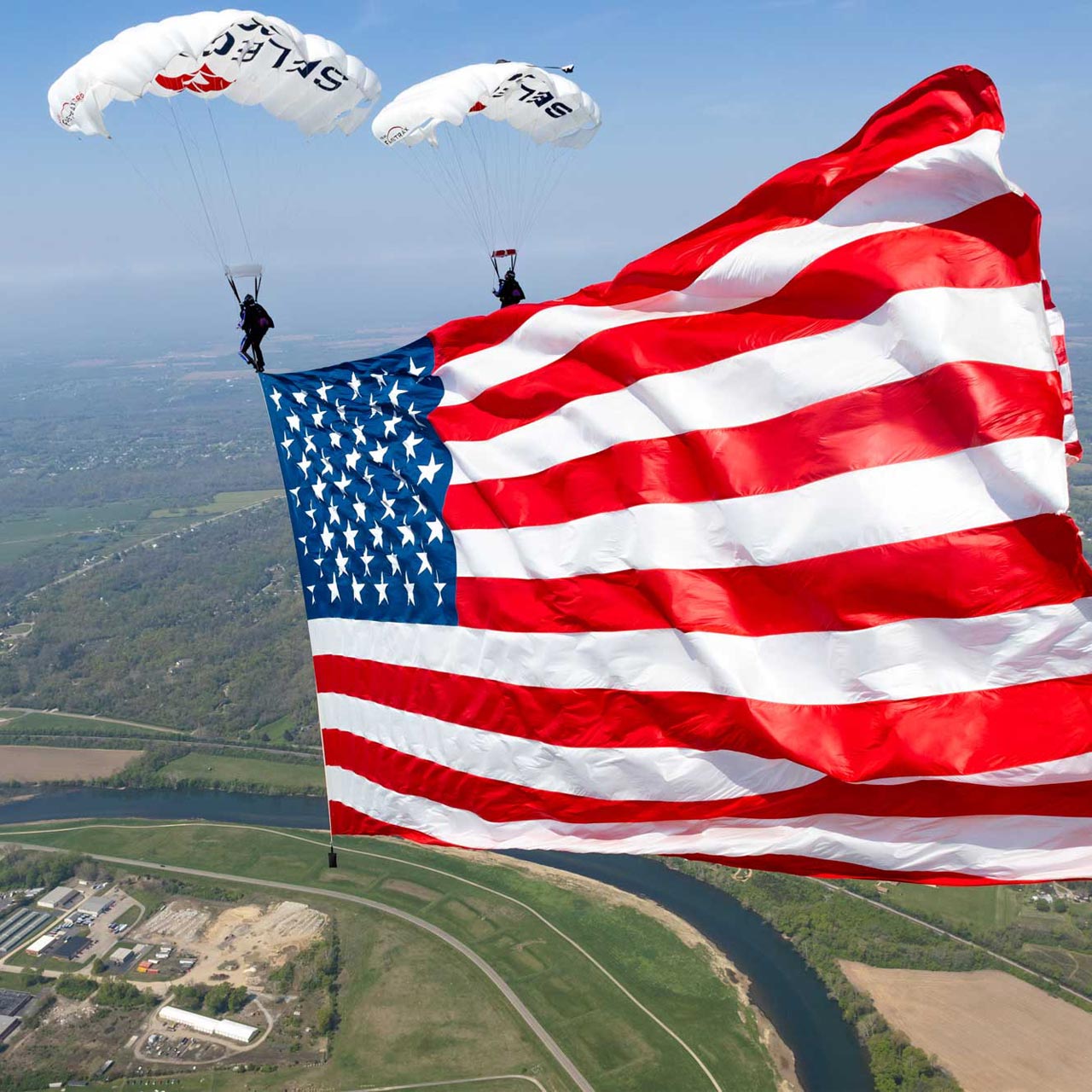 Two members of Team Fastrax fly a demonstration jump with a 5,000 square foot American flag