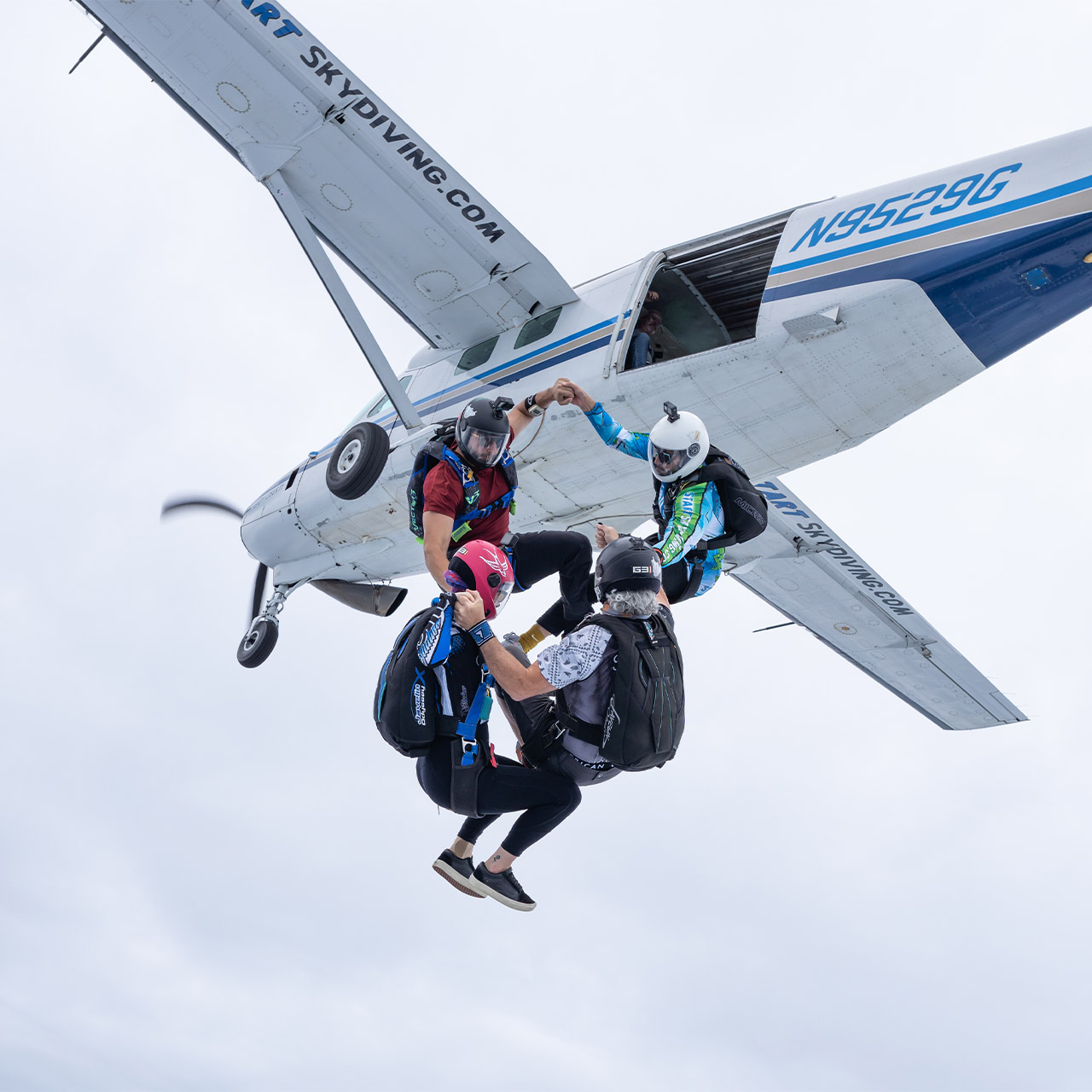 Licensed skydivers launch a head up round from the Cessna 208 Grand Caravan